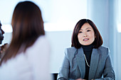 Businesswomen talking in meeting