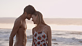 Affectionate young couple on beach