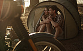 Affectionate young couple in tent