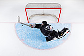 Hockey goalie at goal net