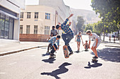 Teenage friends skateboarding