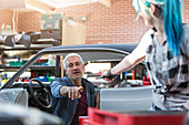 Mechanic reaching for tool