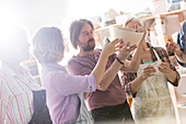 Mature students examining bowl