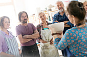 Teacher showing pottery bowl