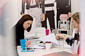 Fashion buyers working at desk in office