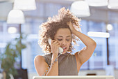 Businesswoman talking on telephone