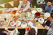 Friends enjoying lunch at patio table