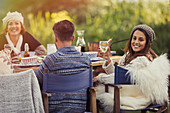 Smiling woman drinking wine