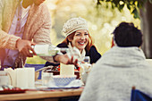 Friends enjoying lunch at patio table