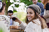 Woman drinking wine with friends