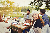 Woman enjoying lunch at lakeside