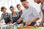 Students watching chef teacher