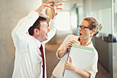 Businessman making snarling gesture