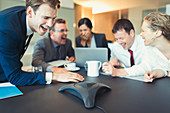 Laughing business people on conference call