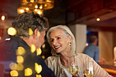 Senior couple drinking white wine in bar