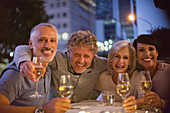 Portrait smiling couples drinking white wine