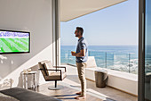 Man watching soccer on TV