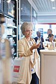 Woman shopping for perfume duty free shop