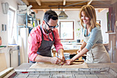 Stained glass artists working in studio