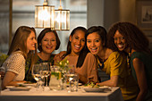 Portrait smiling women friends dining