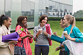 Women friends with yoga mats and coffee