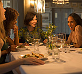 Women friends dining and talking
