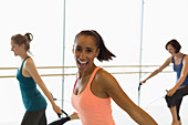 Portrait enthusiastic woman jumping rope