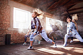 Young women hip hop dancers dancing in studio