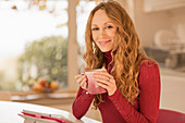 Portrait smiling woman drinking coffee