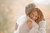 Portrait smiling affectionate couple hugging