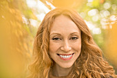 Close up portrait smiling woman with red hair