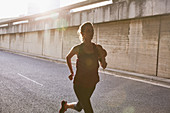 Silhouette female runner running