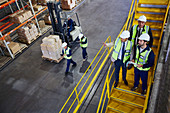 Forklift, managers and workers talking