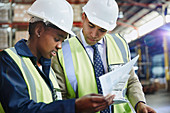 Manager and worker reviewing paperwork