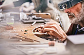 Male jeweller making jewellery