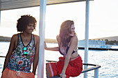 Young couple hanging out on summer houseboat