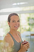 Portrait smiling woman drinking juice smoothie