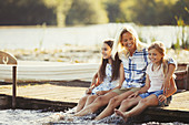 Mother and daughters on dock