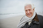 Portrait senior man wearing scarf on winter beach
