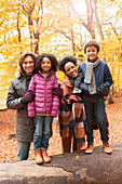 Portrait young family in autumn park