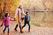 Grandmother holding hands with grandchildren