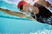 Male swimmer swimming underwater
