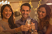 Portrait friends toasting wine glasses