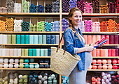 Pregnant woman shopping for candles