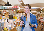 Smiling pregnant woman shopping