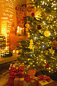 Gifts under illuminated Christmas tree