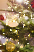 Close up snow ornament on Christmas tree
