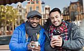 Young men friends drinking coffee