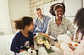 Daughters bringing Mother's Day flowers