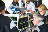 Formula one team reviewing telemetry data